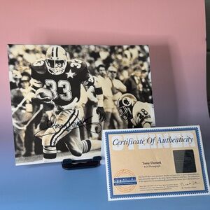 Signed Tony Dorsett Football 8x10 Black and White photo.